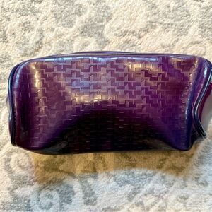 Like New! Clinique Purple Cosmetic Bag in waterproof type material. Cylindrical.